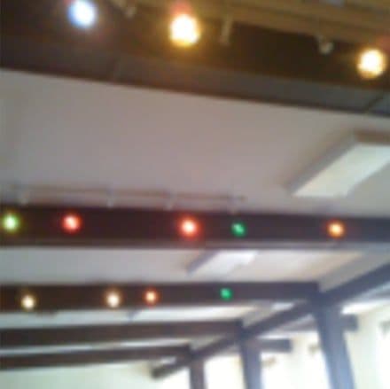 Rows of stage lights across the hall ceiling
