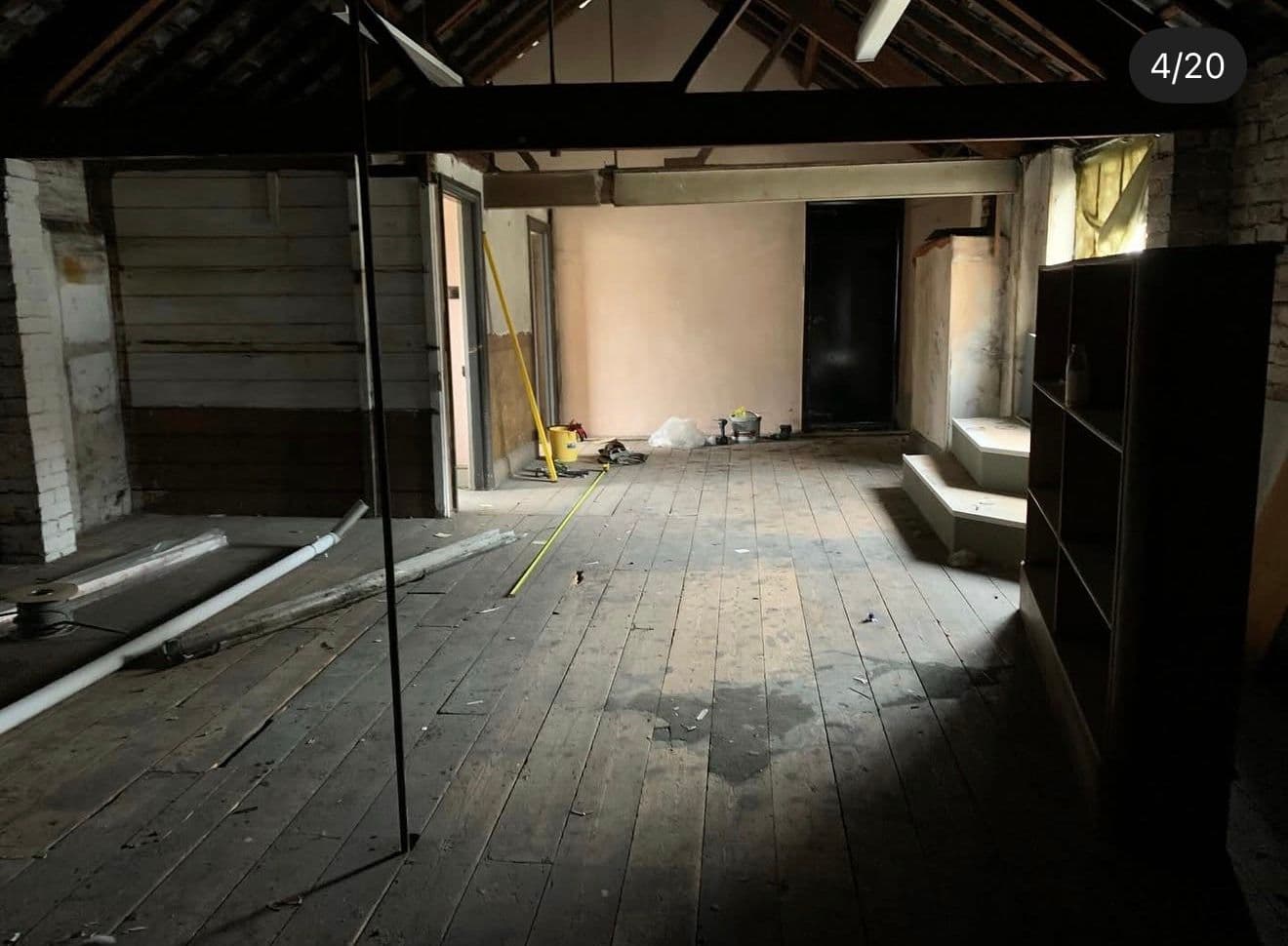 old image of empty room before conversion
