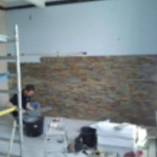 The stone cladding going up