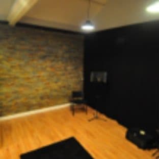 The live room with wooden floor and stone clad wall
