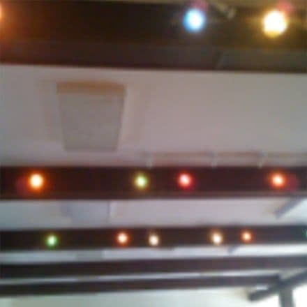 Coloured stage lights on the ceiling bars
