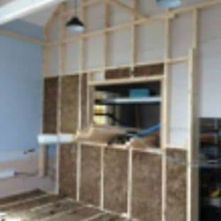 The soundproof partition being built