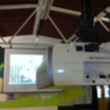 The projector and screen in the main hall